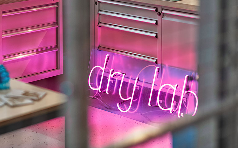 A neon sign reading dry lab.