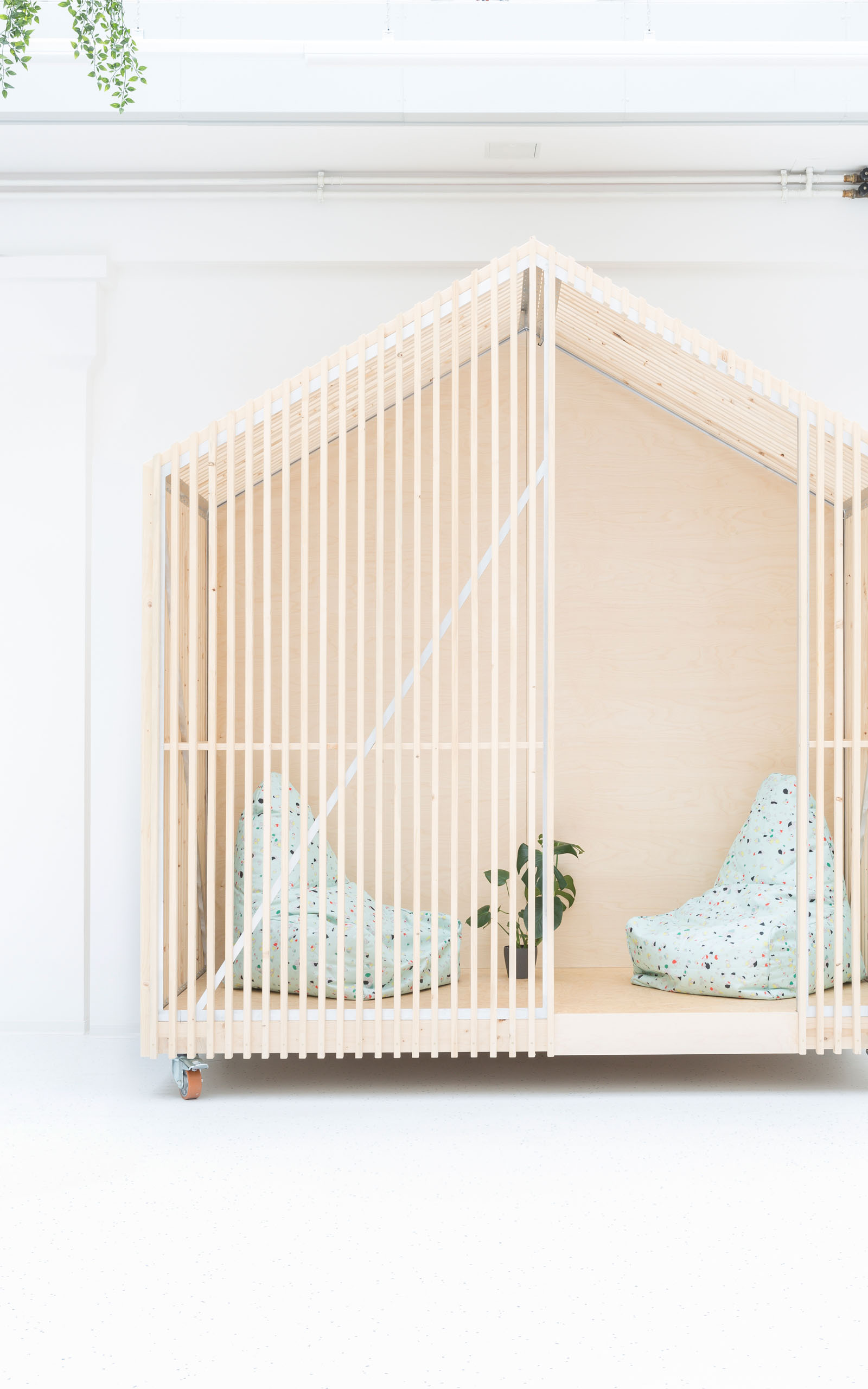 A type of microarchitecture in the iconic shape of a house made from wooden planks.