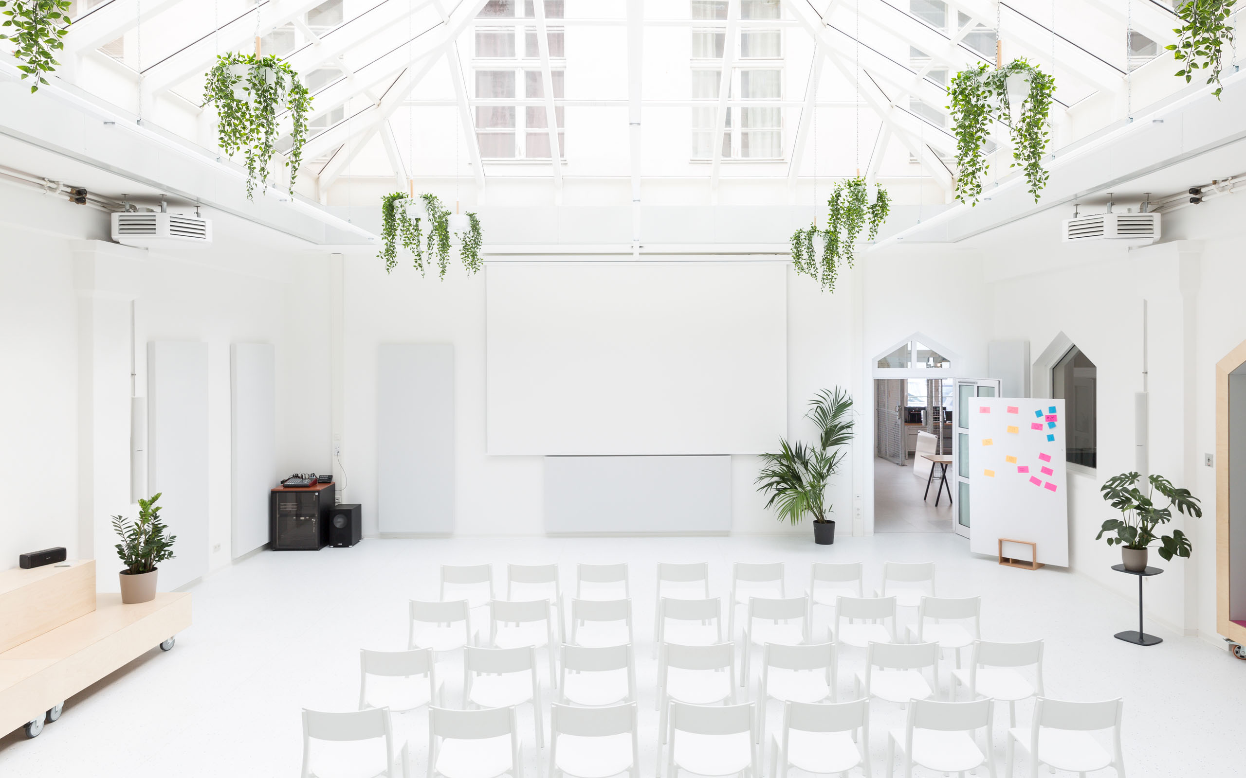 The Startraum event space filled with seating rows ready to be used for presentation purposes.